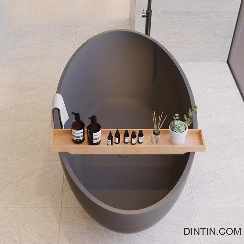 black oval stone bathtub